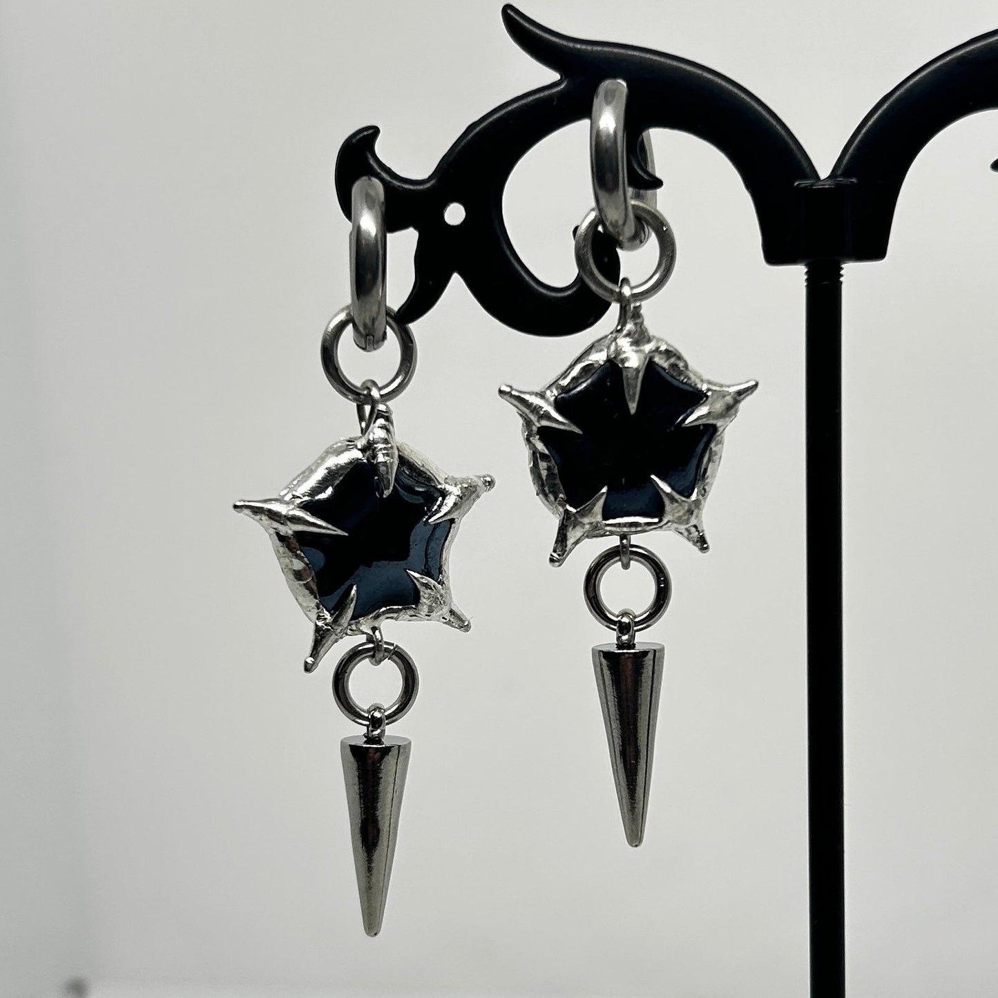 Black Ceramic Star Soft Soldered Spiky
Stainless Steel earrings