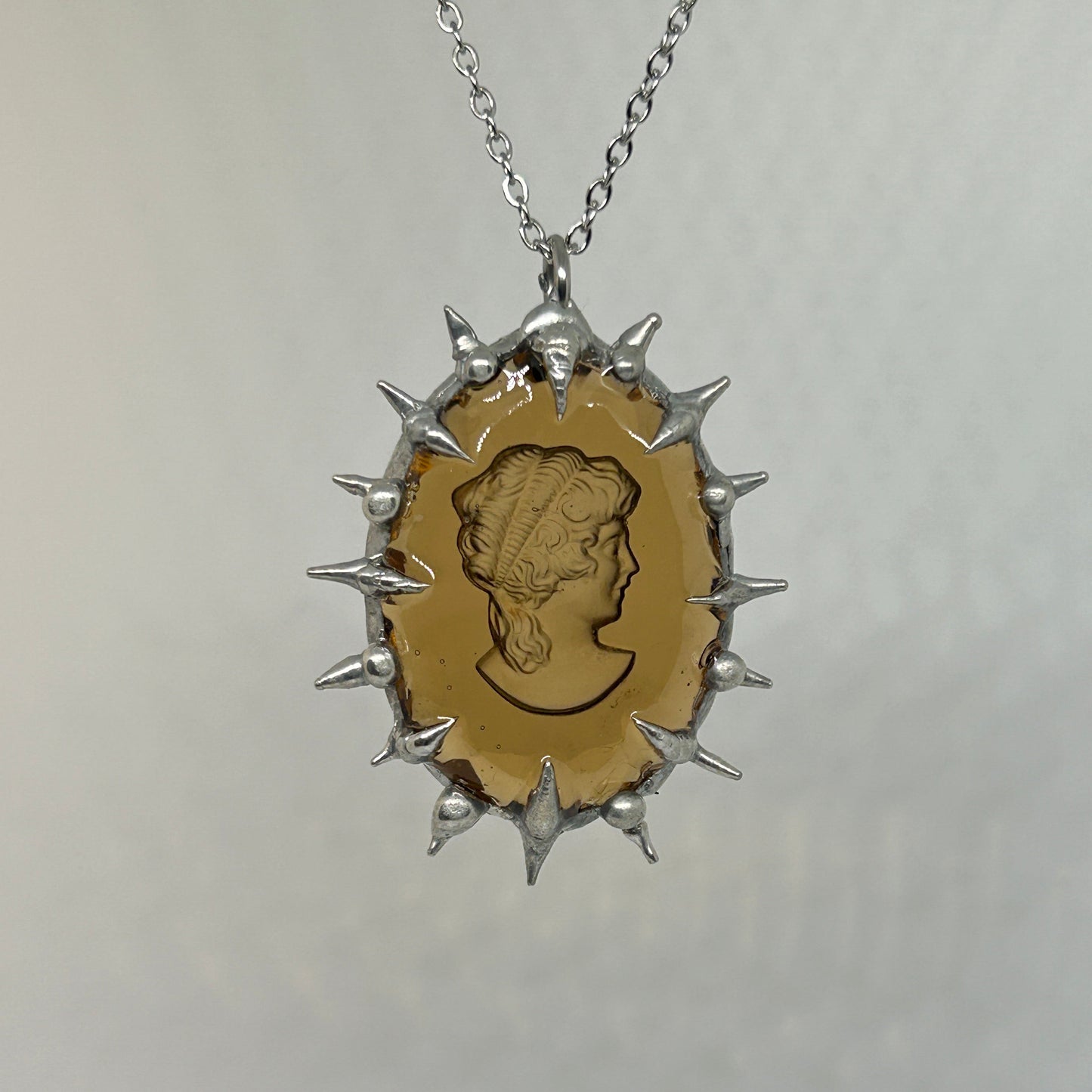 Amber Color Glass Cameo Sillhouette Spiky  Stainless Steel Necklace