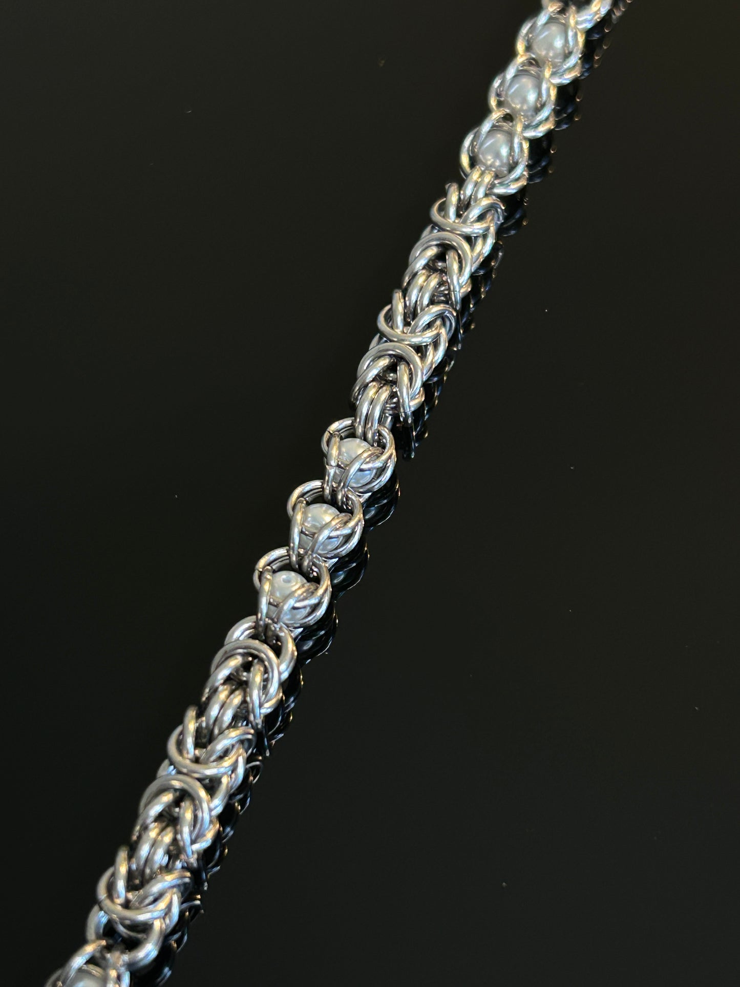 Stainless Steel Chainmail Bracelet With Trapped White Beads